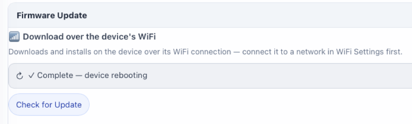 The Firmware Update panel showing "Complete — device rebooting"